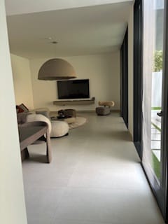 Customer's photo of a modern living room with the Outer Match Carpet under a small coffee table.