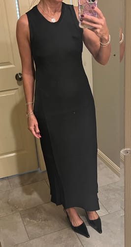 Customer wearing the full-length black Sabrina Sleeveless Satin Dress in a mirror selfie.
