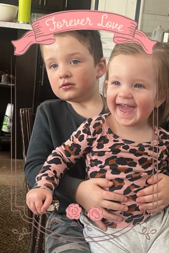 Customer photo of two young children from a review for F-Balm. The boy has a slightly chapped lower lip.