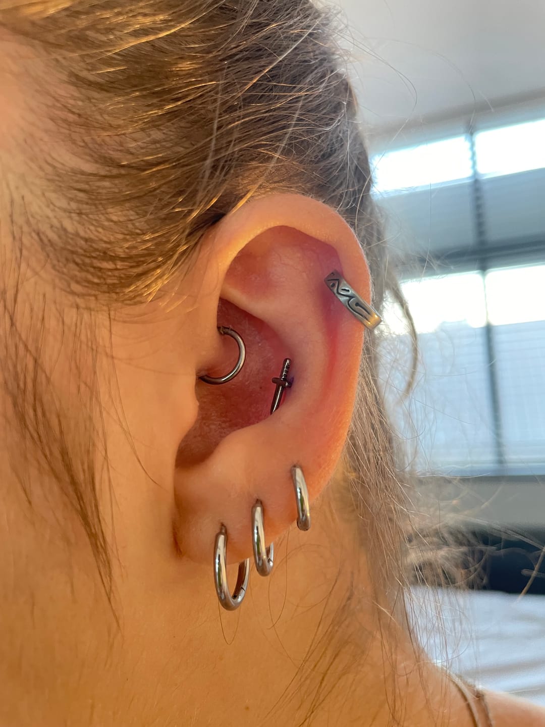Customer photo review of The Titanium Dagger Stud Top