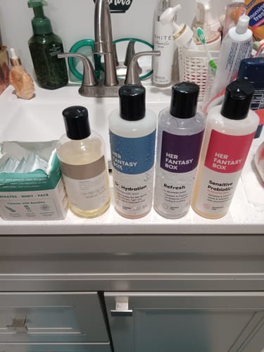 Customer's Date Night Set products lined up on a white bathroom sink counter.