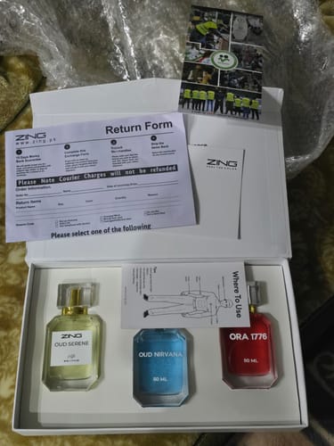 Reviewer's unboxed OUD Supreme BUNDLE, showing the three fragrance bottles: Nirvana, Serene, and Ora 1776 in their case.