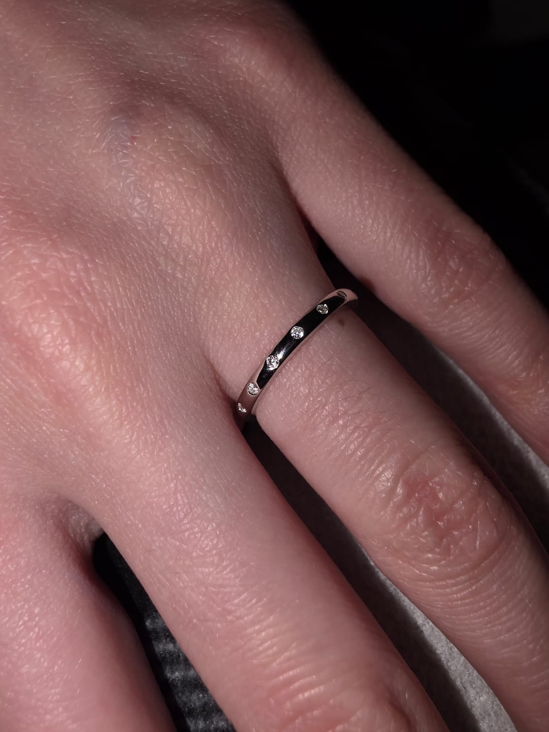 Customer photo review of Flush Set Moissanite Evenly Spaced Eternity Wedding Band