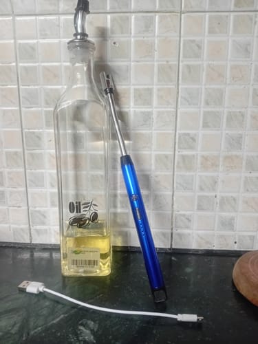 Customer's blue flexible rechargeable electric lighter shown on a kitchen counter with its white USB charging cable.