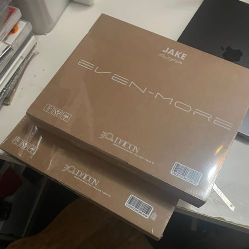 Customer's two ENHYPEN DICON EVEN-MORE packages, stacked and sealed in their original plastic wrapping.