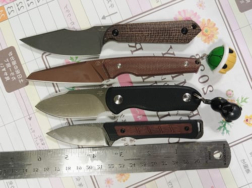 Reviewer's Kizer Whiskey Jack knife (bottom) compared in size to three other knives, aligned by their tips.