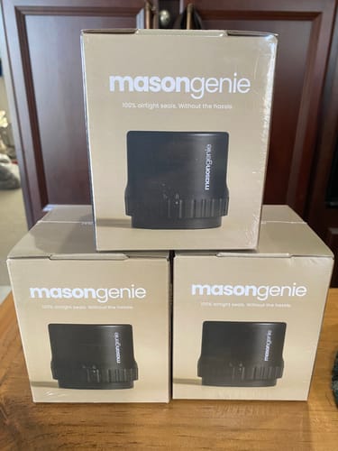 Customer's photo of three Mason Genie product boxes received with their Stainless Steel Funnel.