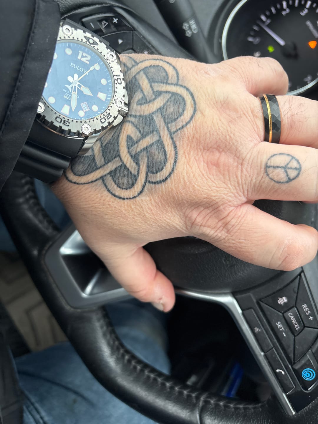 Customer photo review of 8mm- Brushed Yellow Gold Faceted Black Tungsten Off centered Gold Groove.