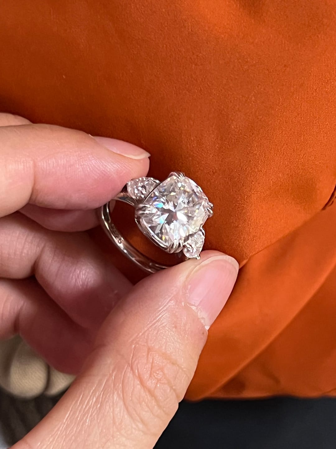 Customer photo review of Moissanite 6.0Ct Cushion Cut Three Stone Engagement Ring In Sterling Silver