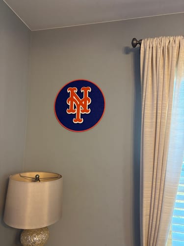 Customer's New York Mets 3D wall art hanging on a grey wall in the corner of a room.