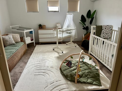 Customer's large, soft Mellow Mat in Vanilla Cream with a 3D pattern, shown on the floor of a nursery.