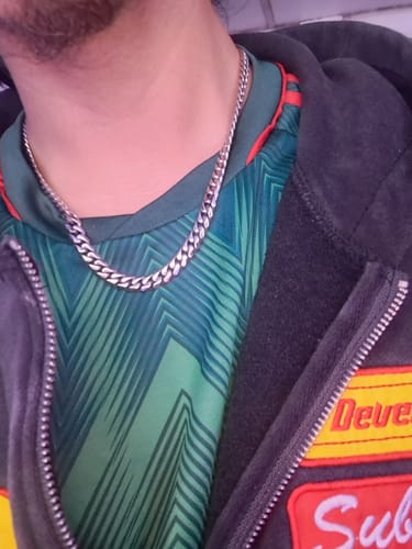 Close-up of a customer wearing the 8MM MINI CUBAN CHAIN around their neck.