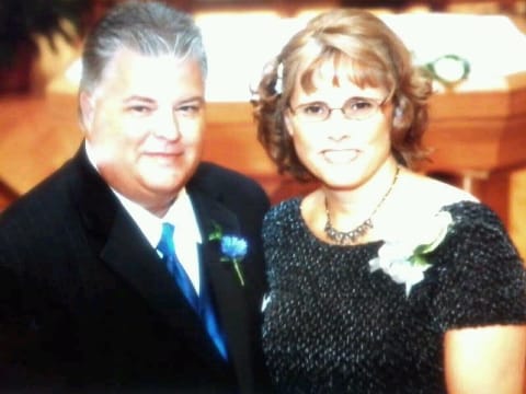 Reviewer's personal photo of a couple, not showing the Hello Fall Grandma's Pumpkin Patch wooden plaque.