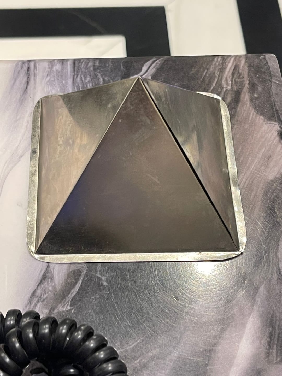 Customer photo review of Tri-Dhatu Hollow Vastu Pyramid – Alloy Metal Vastu Remedy for Protection & Prosperity | Ideal for Home, Office & Spiritual Areas | 4 cm | 120 g