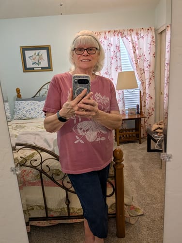 Customer's mirror selfie showing the user after using The Micro Infusion System for smoother skin texture.