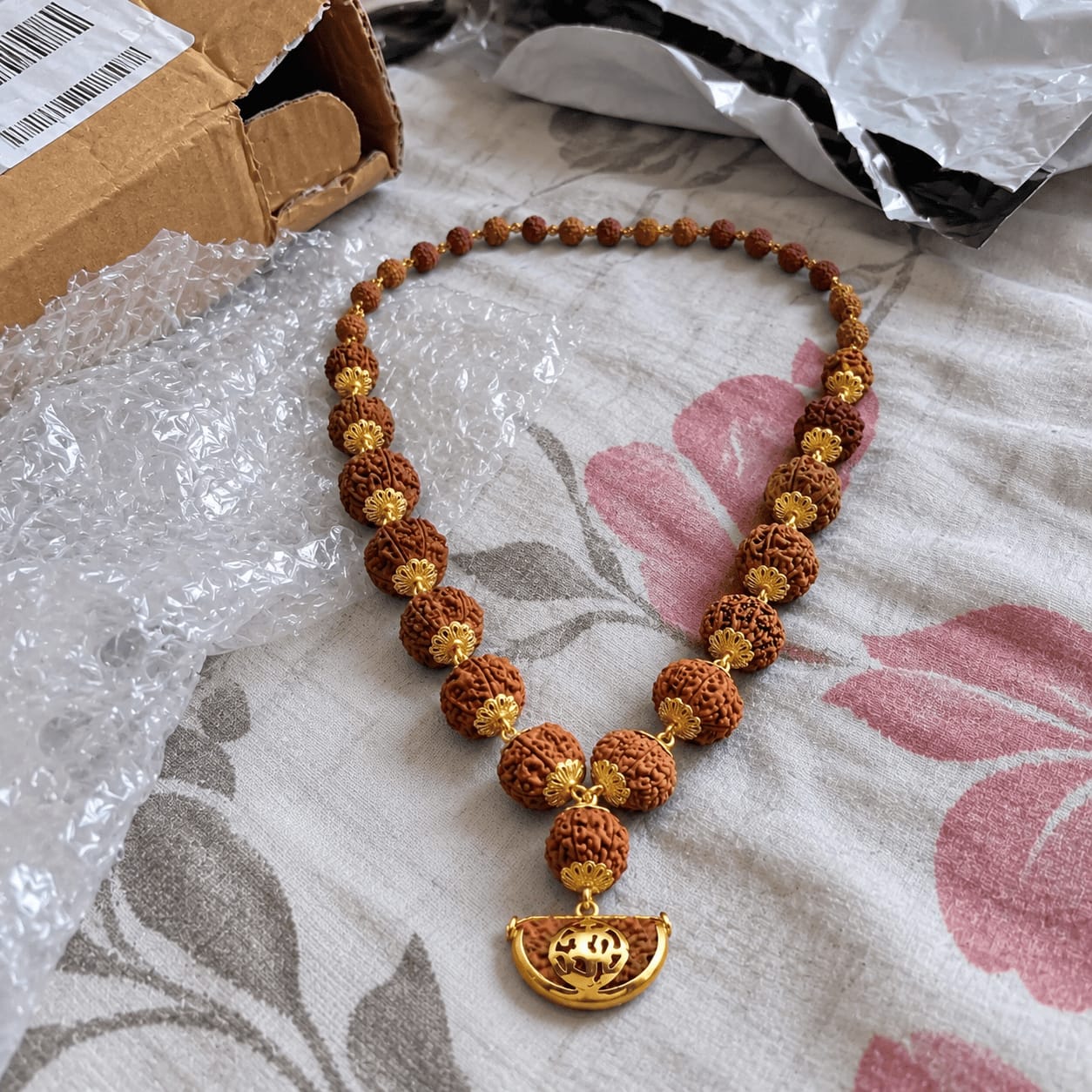 Customer photo review of 1-14 Mukhi Rudraksha Mala (Panchdhatu)