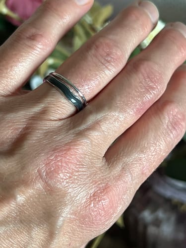 Customer's Layered Black Sahara Silver Ring worn on a finger, showing the layered design.