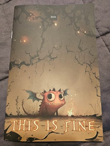 Customer's October 2026 Booklet, showing a small dragon illustration by a fire under dark, spindly trees.