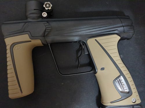 Customer's Infamous Deuce 1R DNA Trigger installed on a black and tan paintball marker.