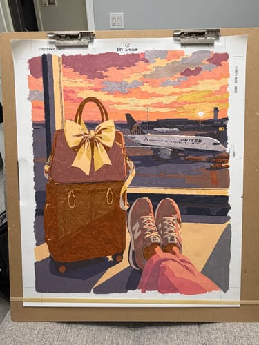 Customer's Destination Happiness painting on canvas, showing a travel suitcase and person viewing a plane at sunset.