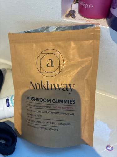 Customer's Ankhway Mushroom Gummies brown bag sitting on a surface.