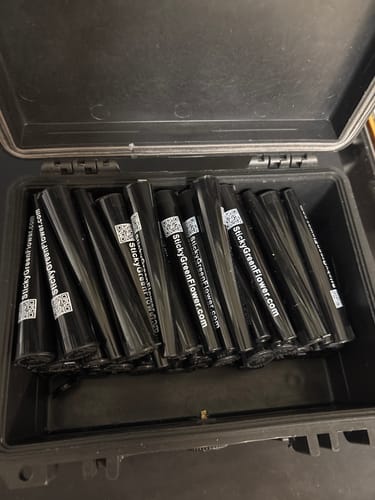 Customer's Pre Rolls 100ct packed inside a black storage case.