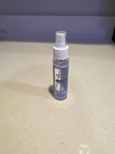 Customer's A Gift From Nature antibacterial hand sanitizer spray bottle standing on a light-colored countertop.