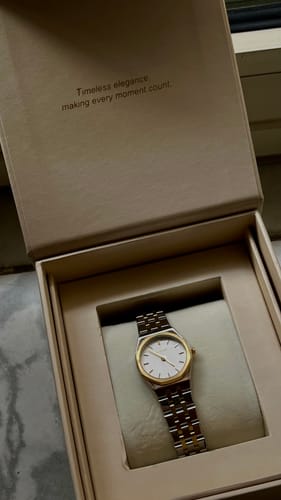 Customer's Victoria Gold Silver watch in its open, branded gift box.