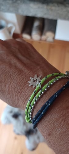 Customer's Bracciale Stella Alpina in Argento 925, worn on wrist with lime and dark blue cord bracelets