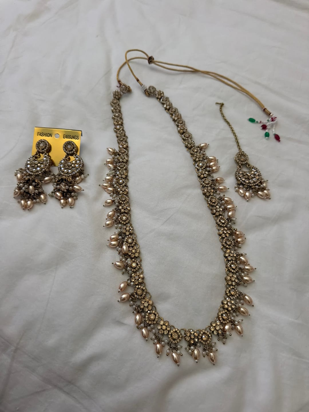 Customer photo review of Aniya Gold Long Kundan Necklace Tikka Earrings Set