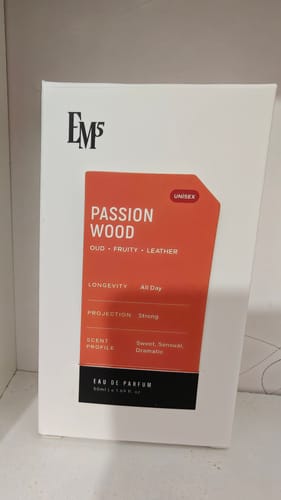 Reviewer's white box for Passion Wood Eau De Parfum featuring an orange label with scent profile details.