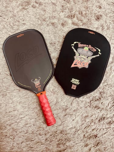 Customer's Loco 16mm Pickleball Paddle alongside its branded paddle cover on a carpeted floor.