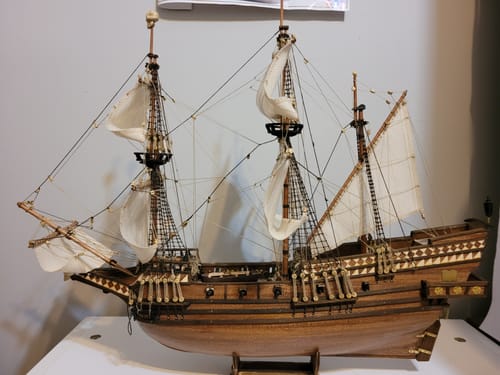 Customer's completed Cisne Negro wooden ship model with sails and detailed rigging on a display stand.