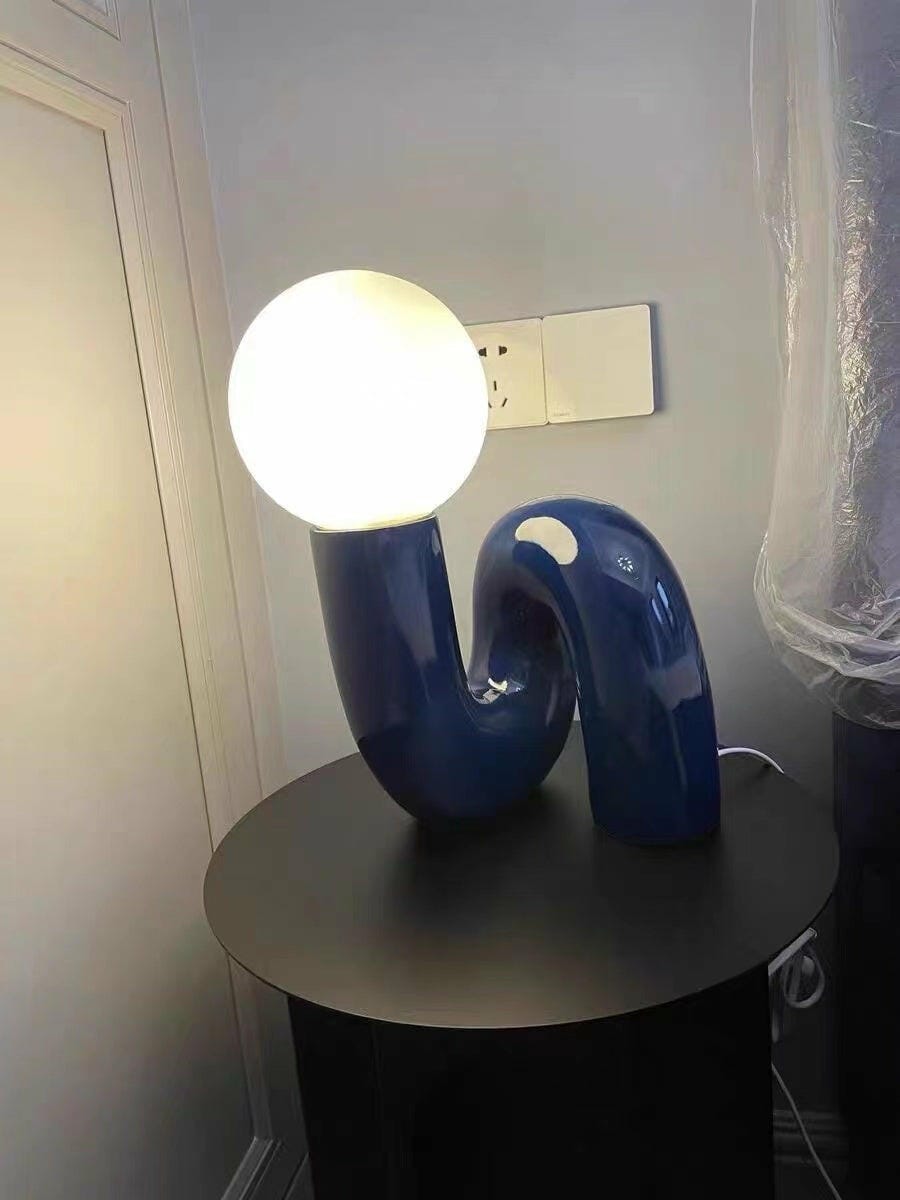 Customer photo review of Globe Table Lamp, White Glass Shade on Curved Resin Base
