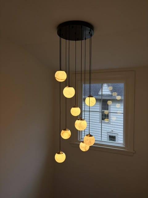 Customer photo review of Alabaster Sphere Pendant Light, Black Canopy, 3 to 18 Heads