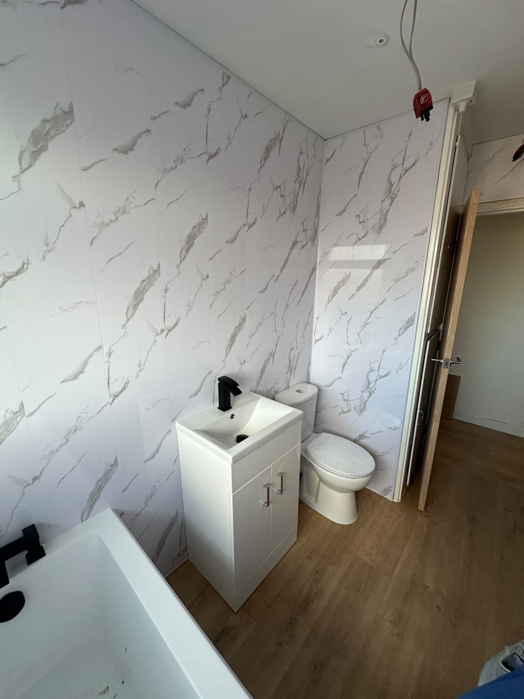 Customer photo review of 4 Pack | 8mm Carrara White Marble Gloss Wall & Ceiling Panel 2.6m