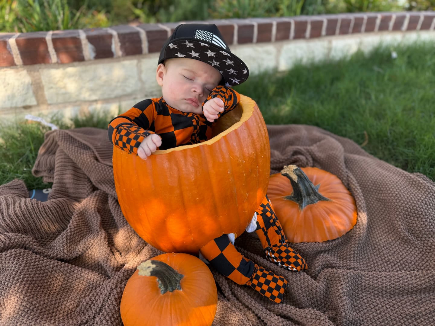 Customer photo review of Bamboo Zippy Sleeper in Jack-O Lantern Checkered
