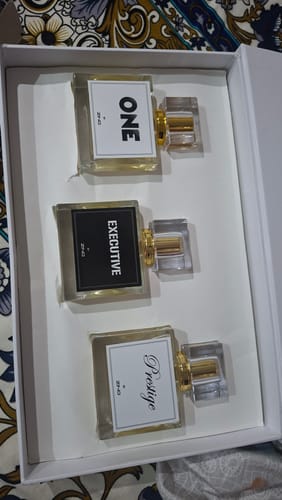 Customer's OUD Supreme Bundle gift set in a white box with three distinct perfume bottles labeled ONE, EXECUTIVE, and Prestige.