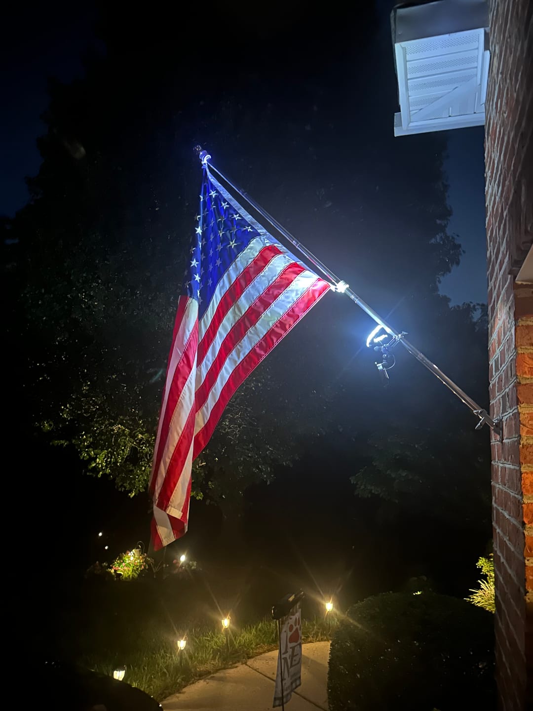 Customer photo review of NEW! Solar Flagpole Light for Wall-Mounted Flagpoles