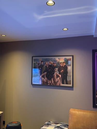 Customer's Unmasking the Enigma framed art print hanging on a dark wall in a living space.