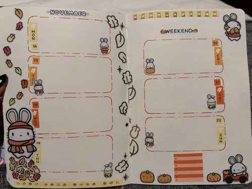 Customer's bullet journal decorated with Autumn Bunnies sticker set, featuring planner sheets and die-cut stickers.