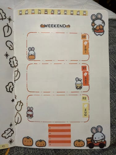 Customer's weekend planner page decorated with Autumn Bunnies stickers and pumpkin die-cuts.