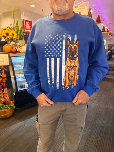 Customer's blue Belgian Malinois USA Crewneck Sweatshirt featuring a graphic print of a dog in front of a US flag.