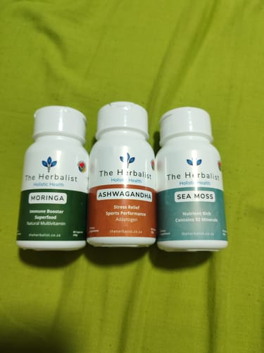 Customer's Reset Bundle featuring three white plastic bottles of Moringa, Ashwagandha, and Sea Moss supplements.