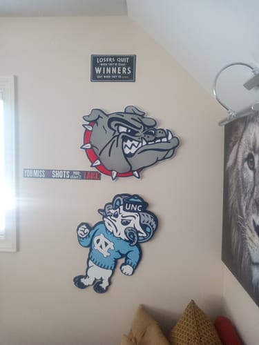 Customer's Gonzaga Bulldog 3D Vintage Metal Wall Art mounted on a wall above a North Carolina mascot piece.