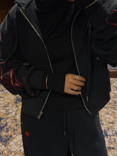 Customer's Aelfric Eden hoodie set in black, showing the oversized fit and red embroidery details.