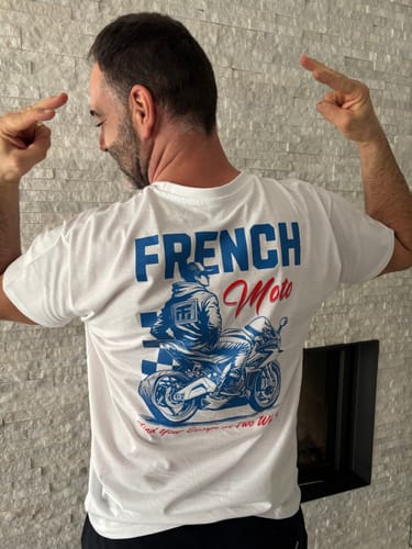 Customer's white COLLECTION ESCAPE t-shirt with a blue and red graphic showing a person on a motorcycle.