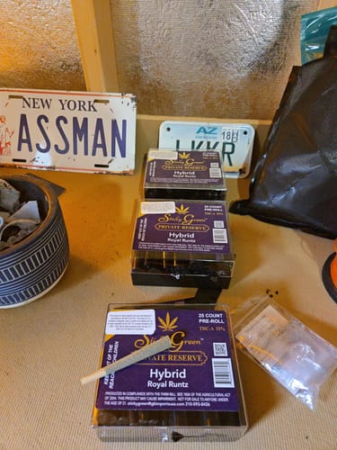 Customer's three boxes of Pre Rolls 100ct with one individual pre-roll placed on the top box.