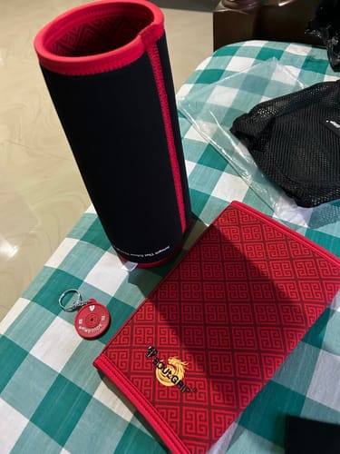 Customer's Soulgrip Powerkey sleeve and folding pad with a small keychain on a green plaid surface.
