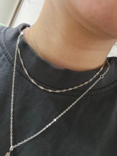 Customer's Mila Twist Silver Chain Necklace worn layered on the neck